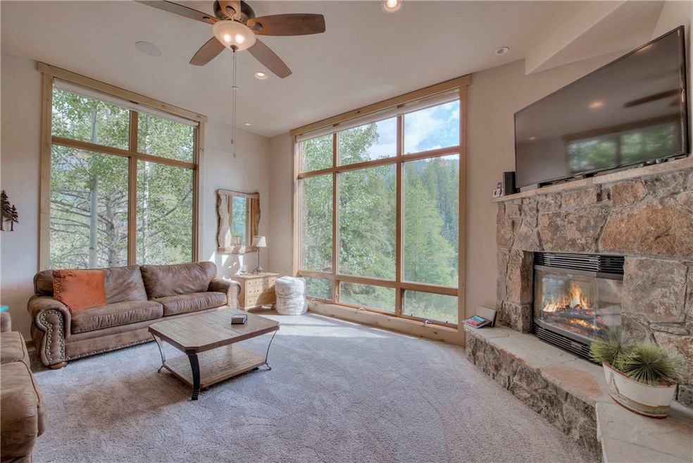 Great room surrounded by a wall of windows