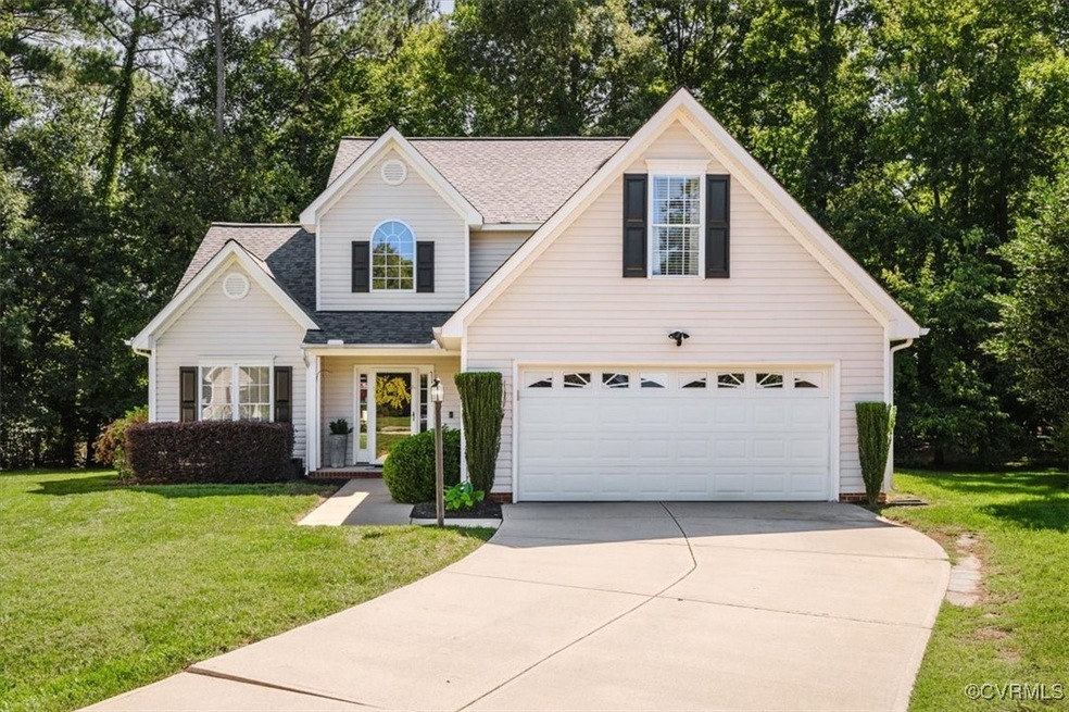 View of front of property featuring a garage and a