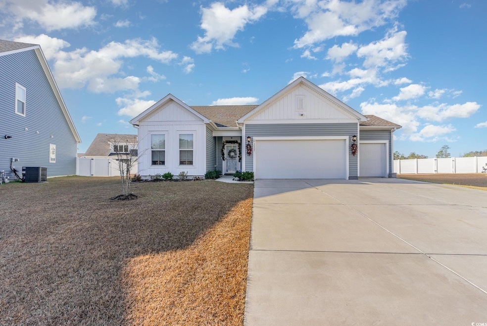 View of front of property with central AC, a front