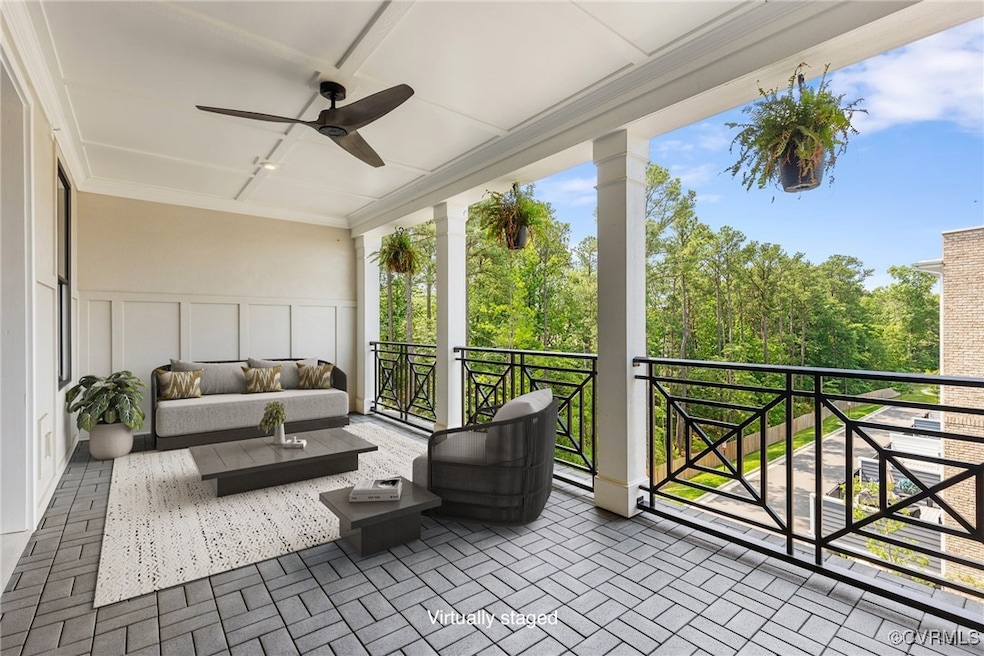 View of patio with a ceiling fan, a balcony, and o