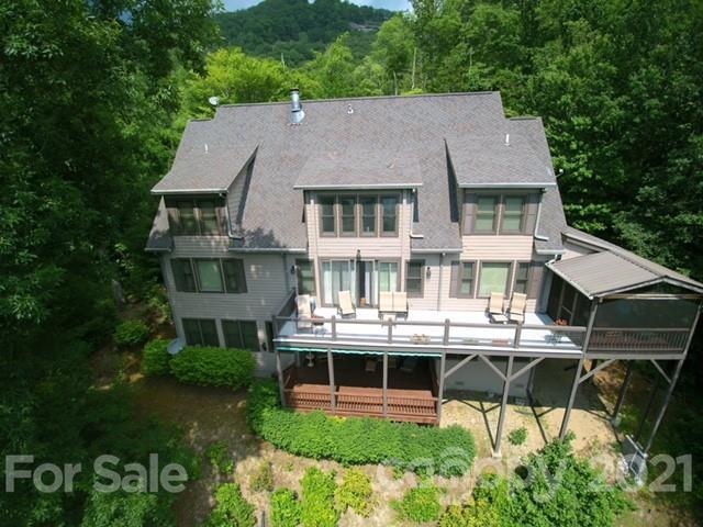 Drone photography view of lake side of house.