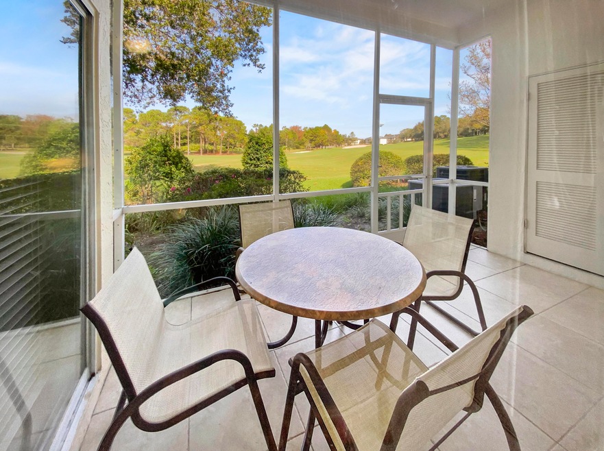 Screened, tile porch with storage