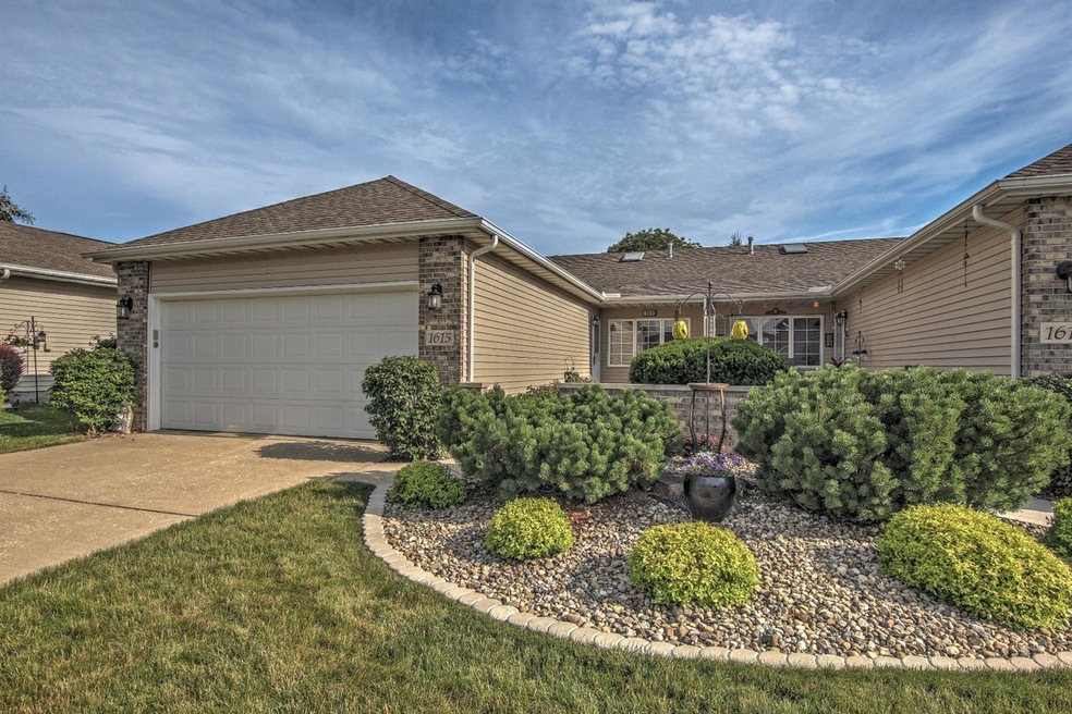 Beautifully Landscaped Brick & Vinyl Sided One Level Ranch Home with Newer Architectural Shingle Roof (2013) & attached Garage w/opener & keyless keypad entry & concrete driveway!