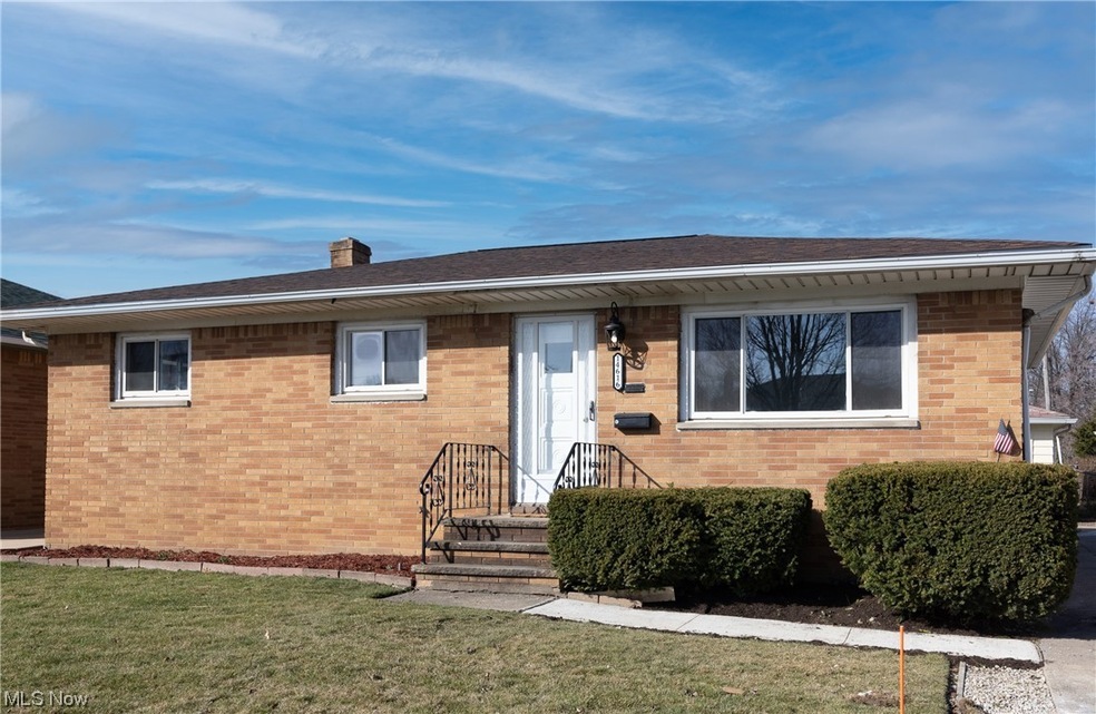 Single story home featuring a front lawn