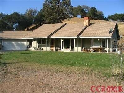 Single story country living on over 3 acres! Garag