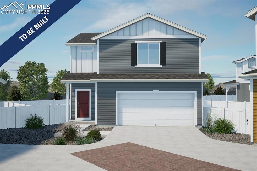 View of front of property with board and batten siding, an attached garage, driveway, and a shingled roof