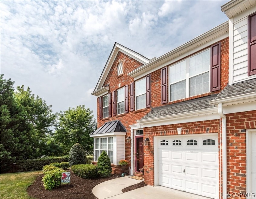Welcome to 9300 Meredith Creek! Beautiful end-unit