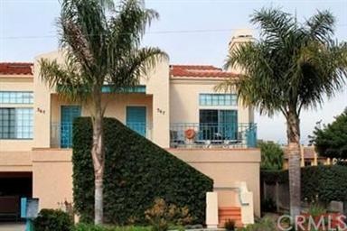 End Unit Condo Provides Extra Light.  2 Car secure