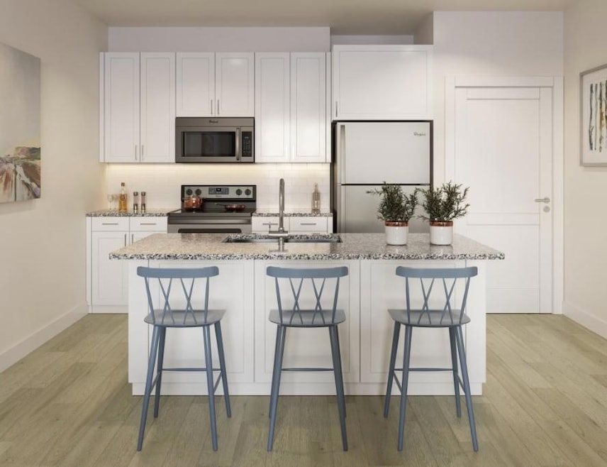 Kitchen with white cabinetry, stainless steel appl
