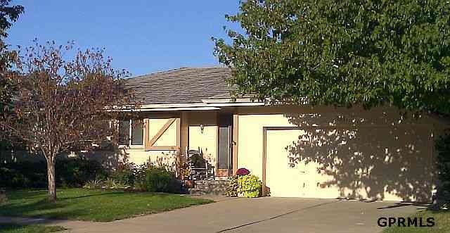 Two car garage and lovely landscaping.