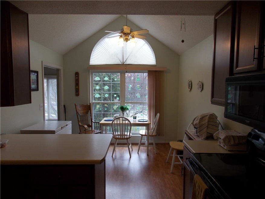 Eat in kitchen with large windows over looking bac