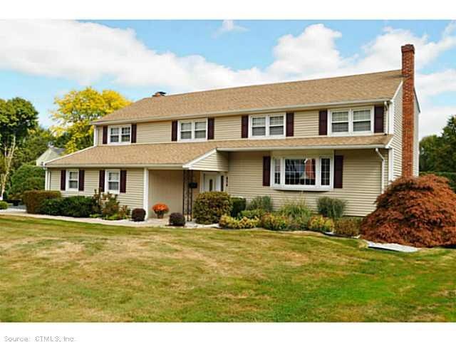 Exterior Front. Professionally landscaped