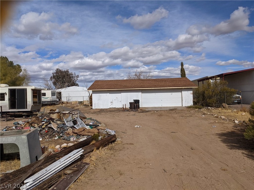 Trash and trailers have been mostly removed. Garag