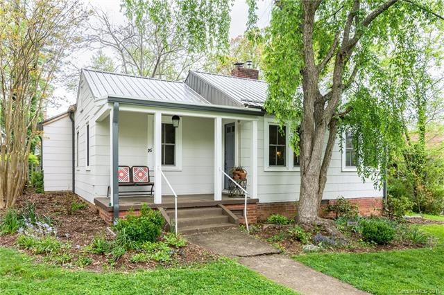 Front of home with charming covered front porch.