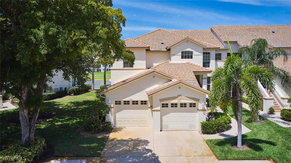 View of front of house with driveway, a tiled roof