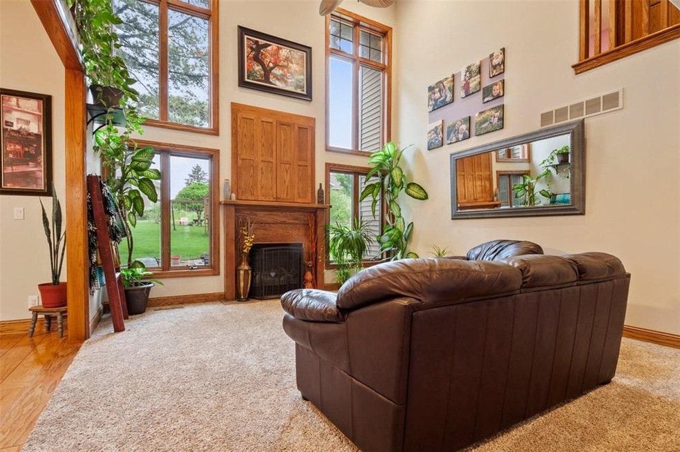 Living room with new carpet, tall volume ceilings,