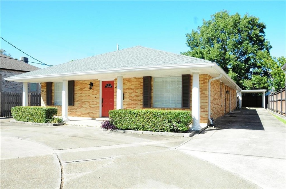 Beautiful brick double front unit. Carport and circular driveway gives much off street parking on Harrison Ave. Two full baths and two bedrooms!!