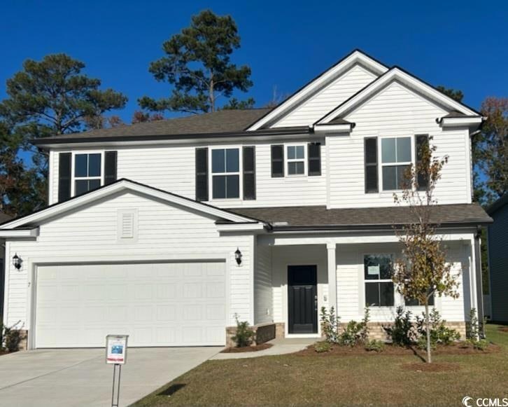 View of front of property with a porch, a front ya
