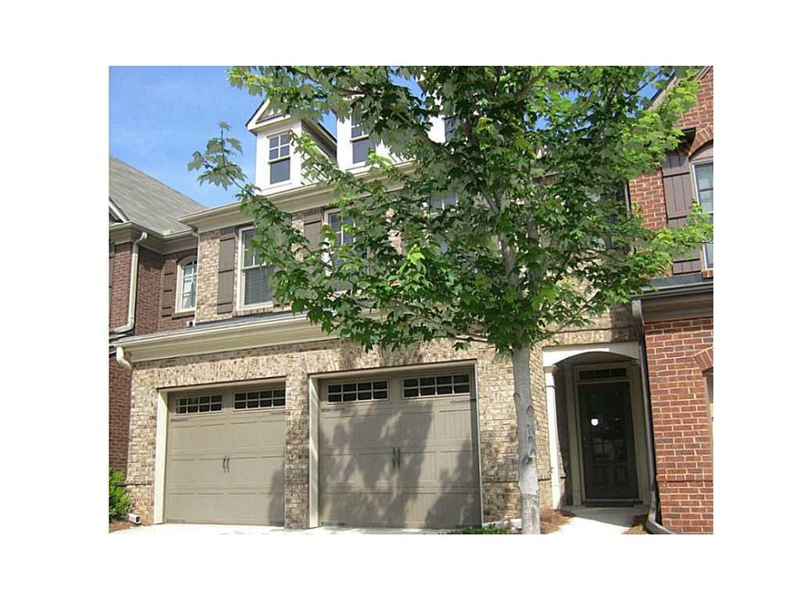 Exterior Front. Beautiful brick gated townhome fea