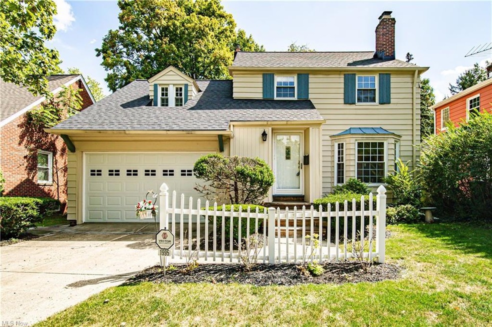 View of front of home featuring garage and a front