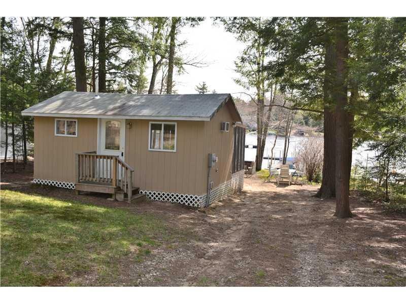 Exterior Front. Driveway side with...