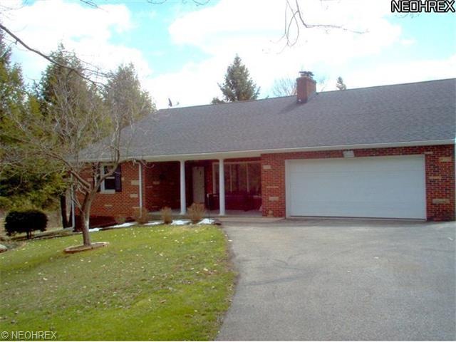 Front view showing attached garage and inviting fr