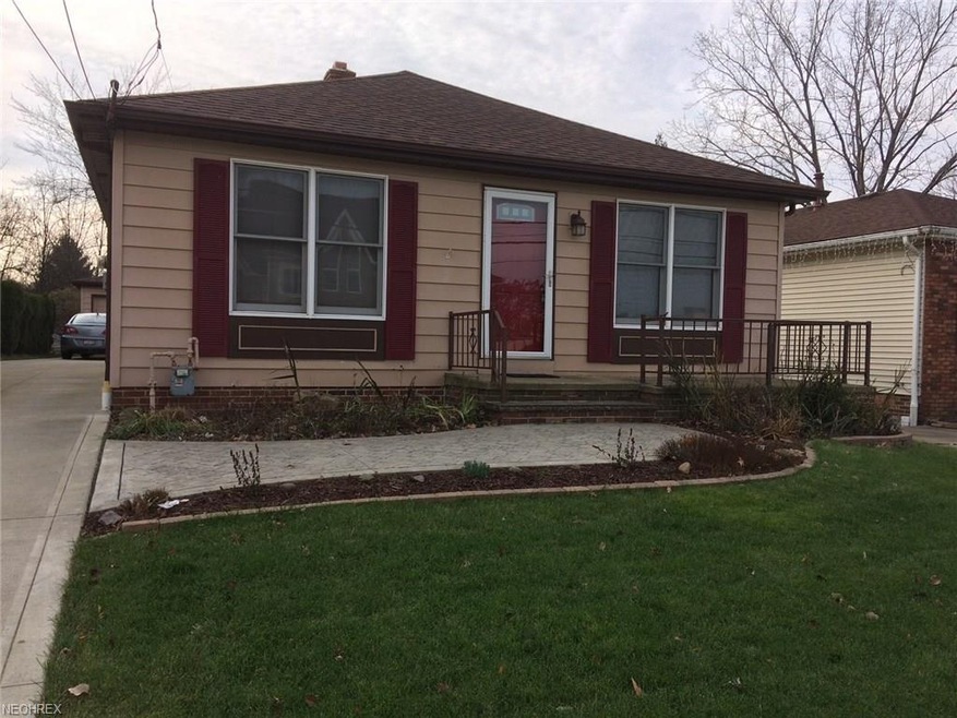 Front of House with stamped concrete walkway and h