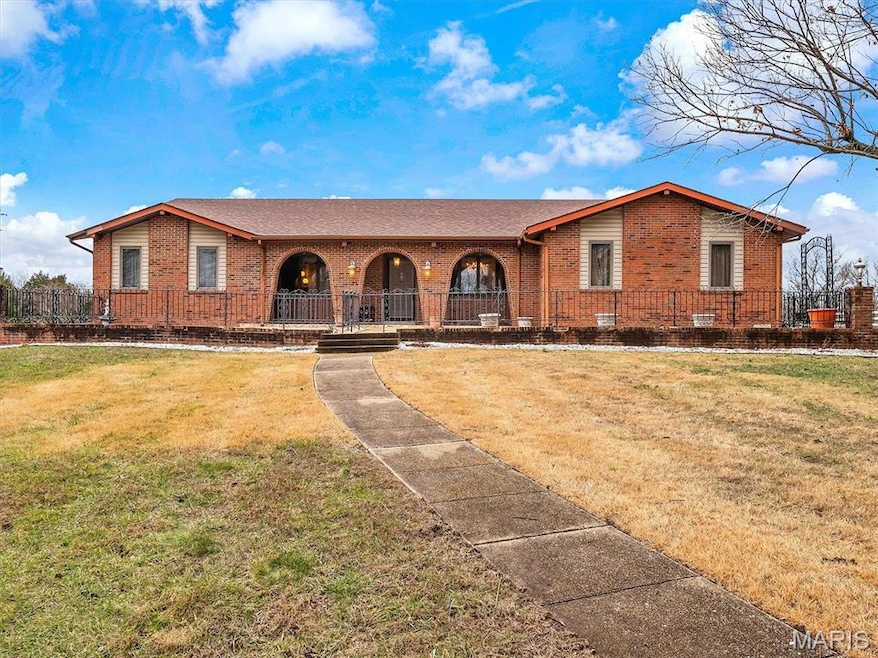 Single story home featuring a front yard