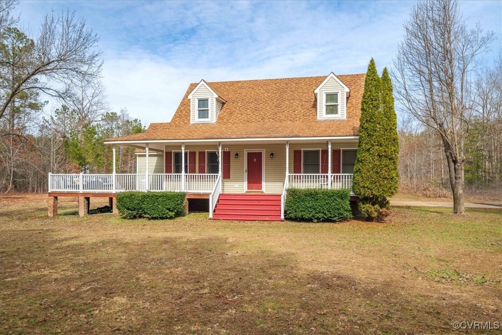 View of front of property with a front yard and a