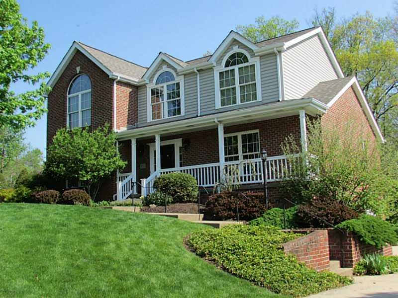 Exterior Front. Custom built brick home in Saddleb