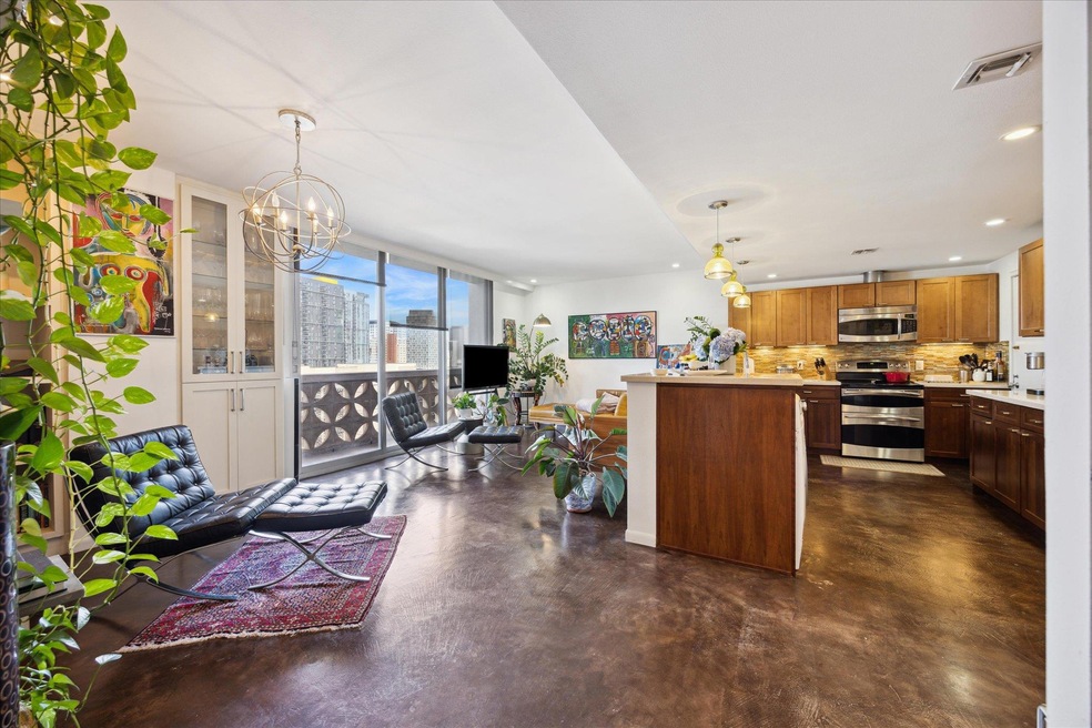 Kitchen featuring stainless steel appliances, tas