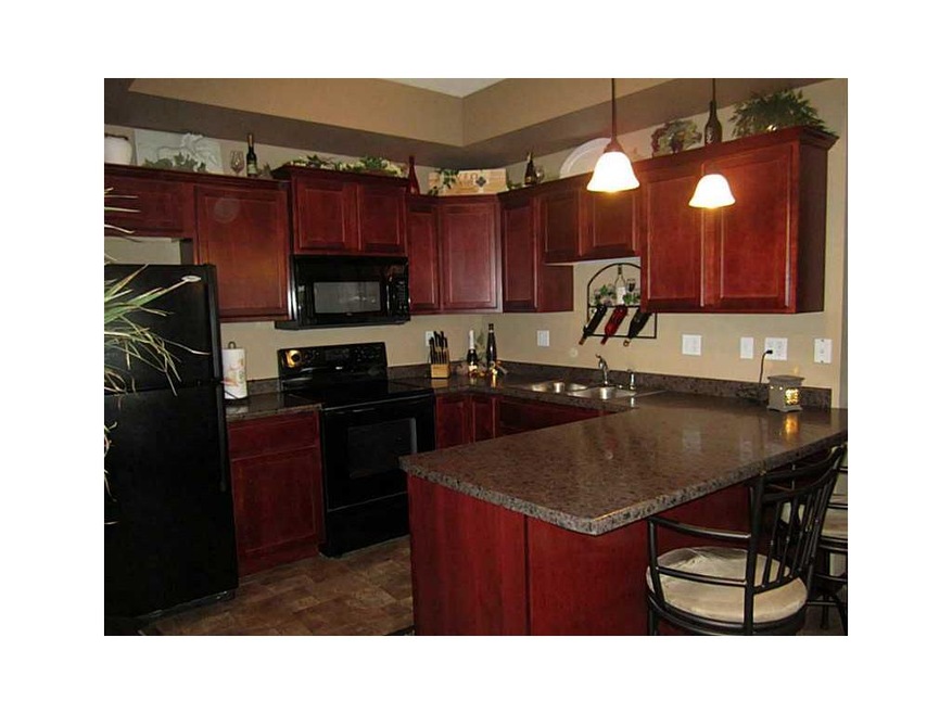 Kitchen. Upgraded kitchen with cherry cabinetry wi