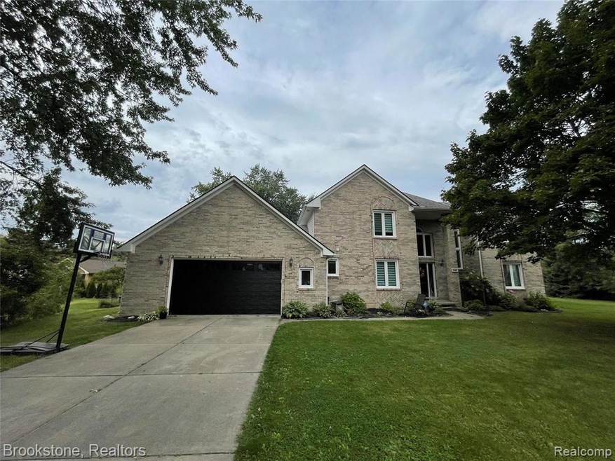 all neutral brick on quiet cul-de-sac