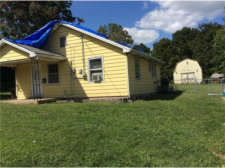 .85 of an acre. Fenced back yard and a barn. House
