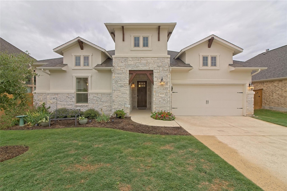 View of front of home featuring concrete driveway