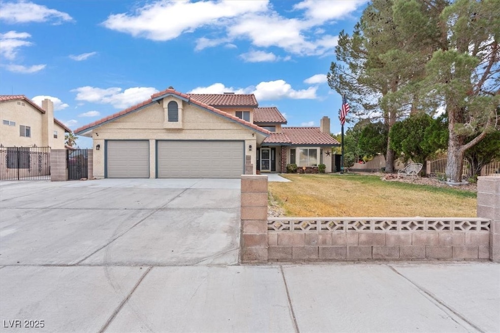View of front of property with concrete driveway, a tile roof, a garage, a chimney, and stucco siding