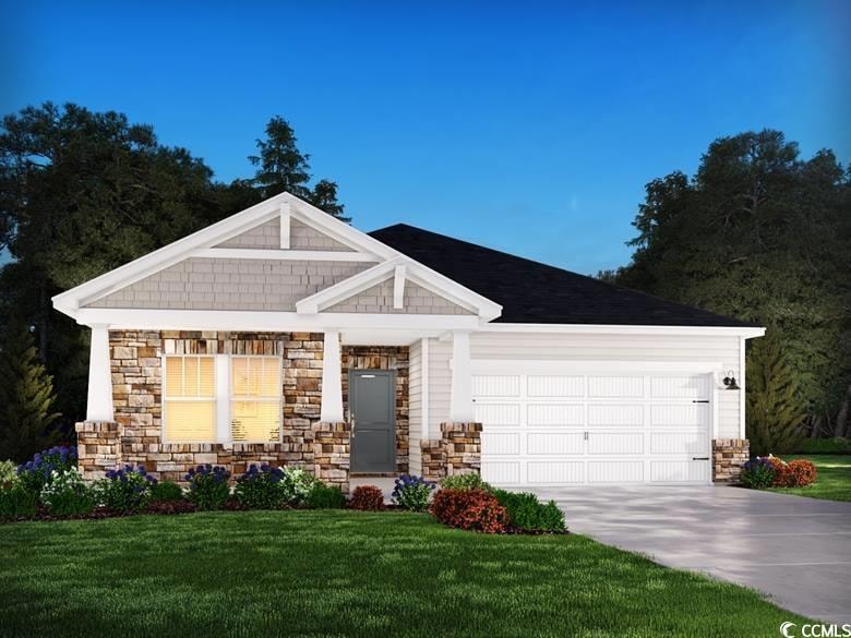 Craftsman inspired home featuring a garage, drivew