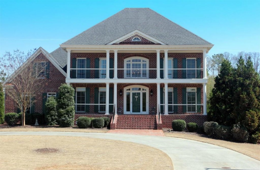 Executive home with double front porches and 4 sid