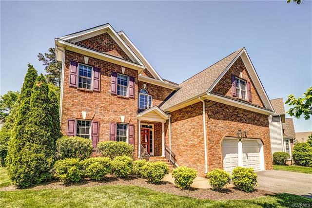 Meticulously maintained brick transitional home in