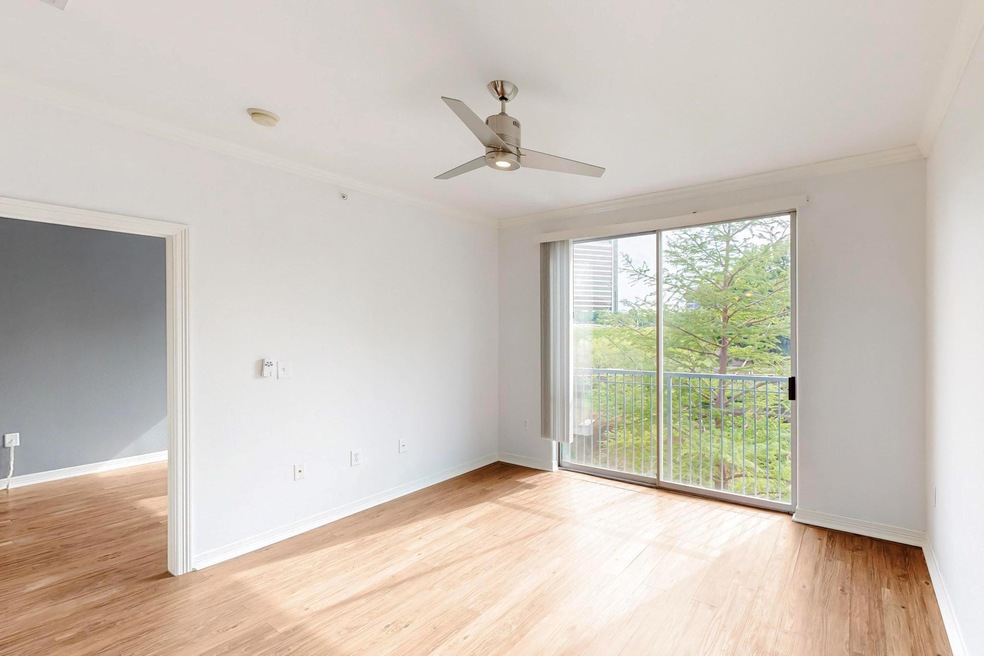 Spare room with a ceiling fan, baseboards, light w