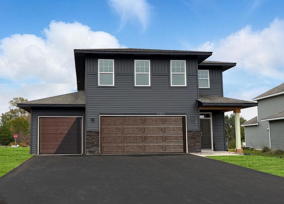 Welcome to the Elm!  This is a photo of the actual home for sale!  *The post on the porch and the trim around the garage still need to be painted**