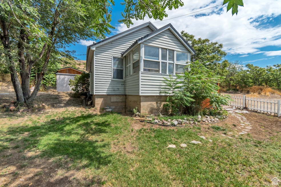 View of home's exterior with a sunroom