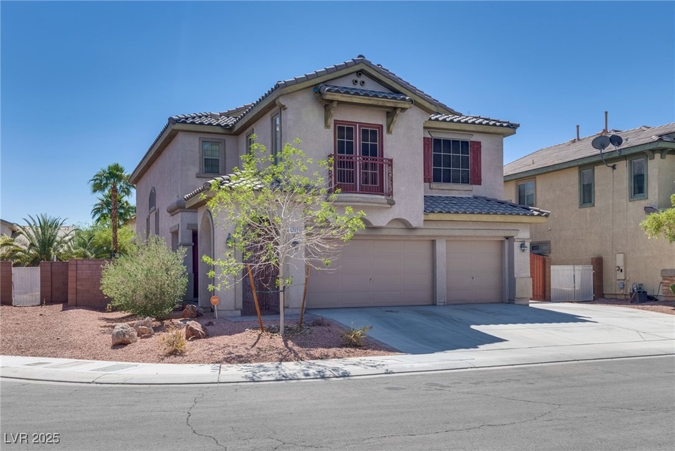 Mediterranean / spanish-style home featuring a gar