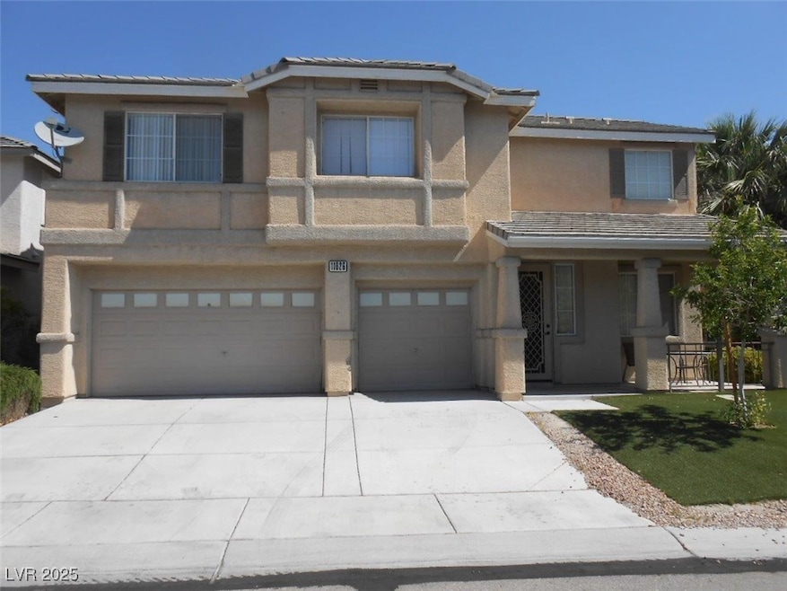 View of front facade featuring stucco siding, an a