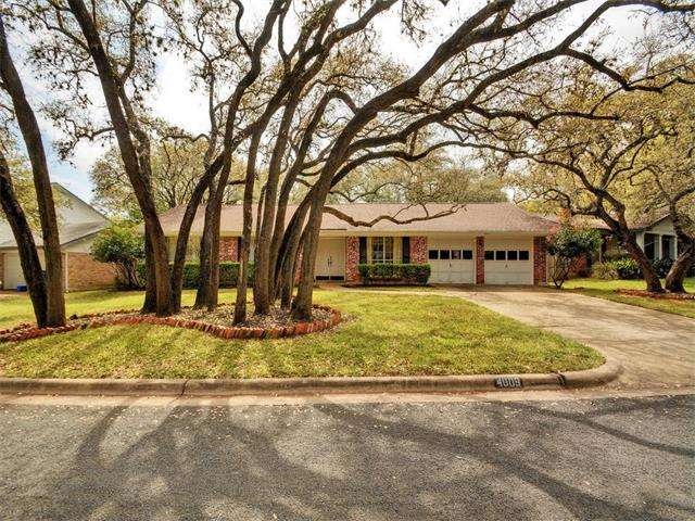 Amazing curb appeal with beautiful, nurtured oak t
