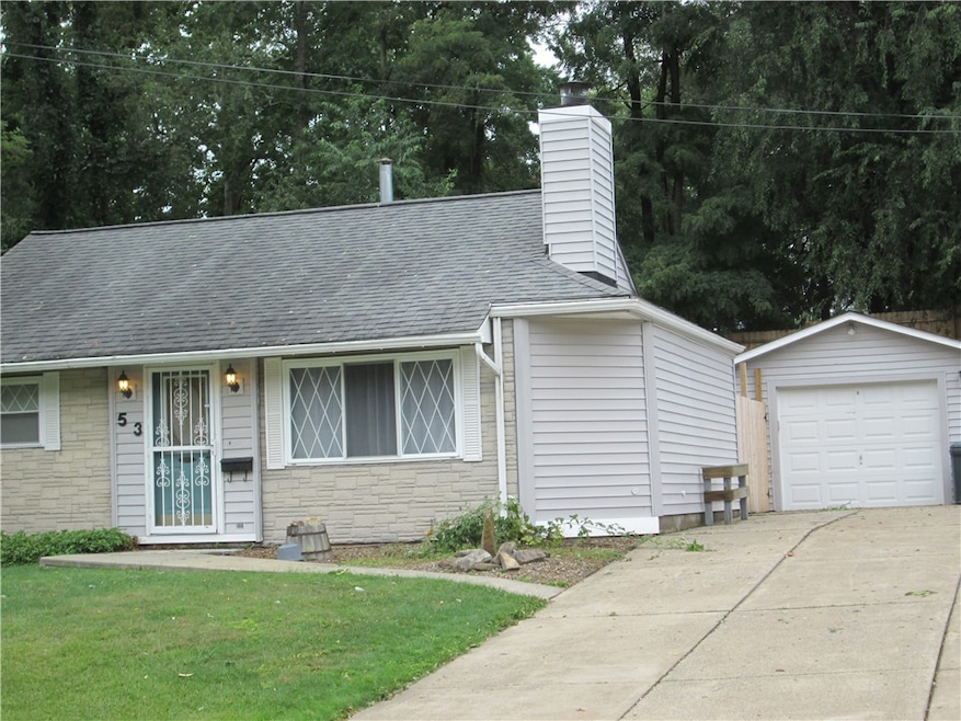 Paved driveway and Detached garage provide more th