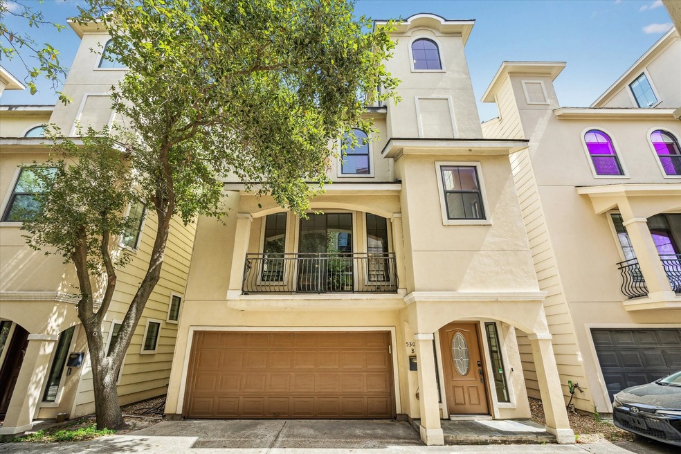 This impressive townhome is tucked into a private