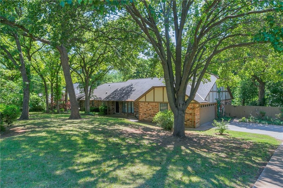 Beautiful 1 acre lot with a variety of trees and f