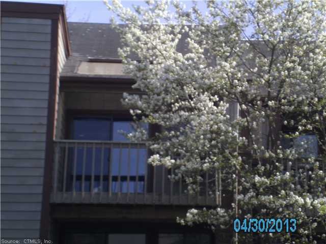 Exterior Front. Balcony overlooks pool area.