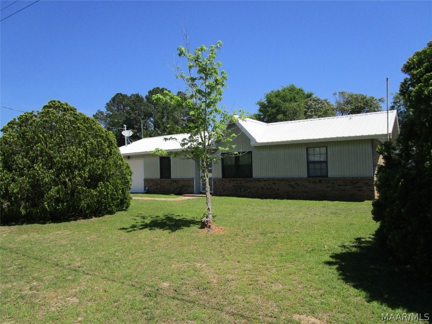 Front of house with metal roof